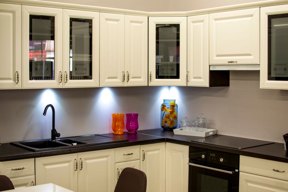 Refinished kitchen cabinets in warm white